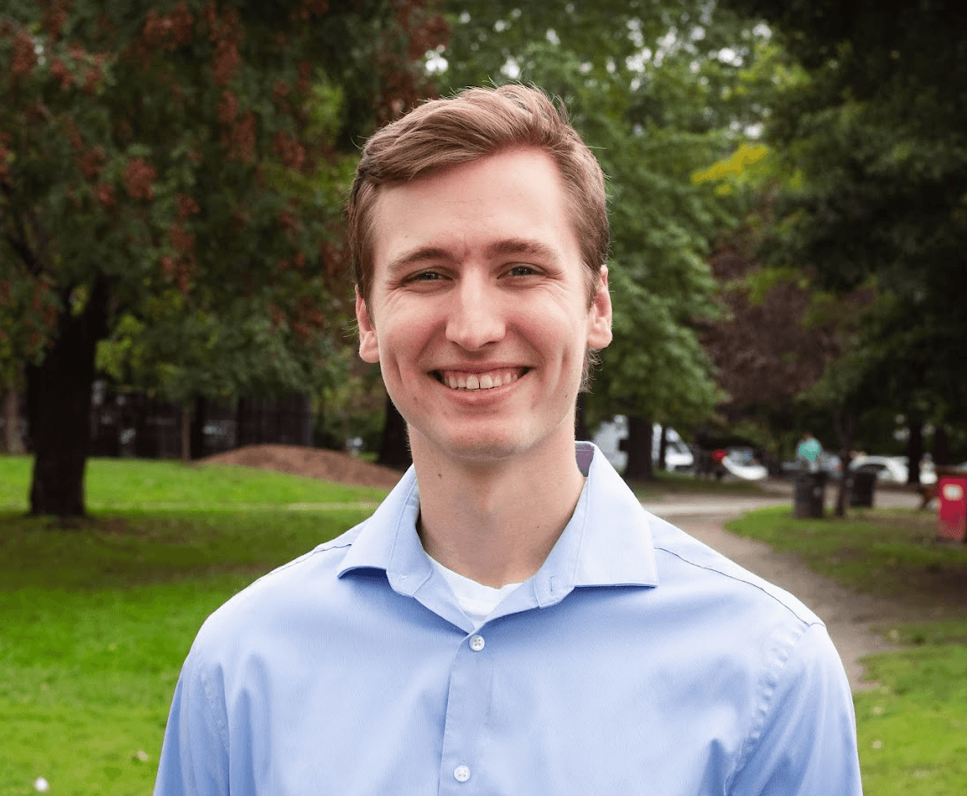 A picture of a man in a collared shirt